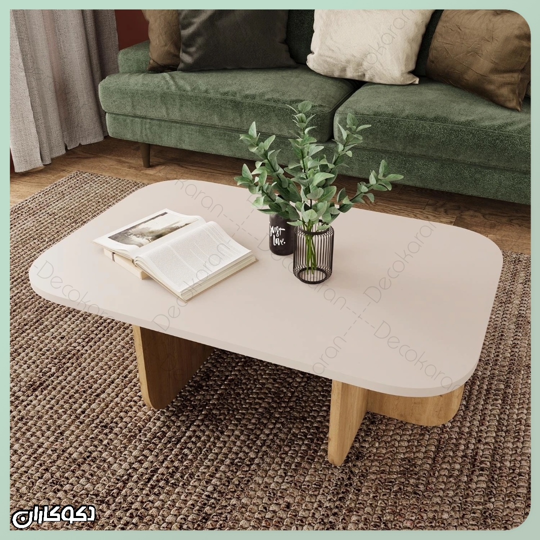 میز جلومبلی مدرن دکوکاران مدل MJ130 در یک چیدمان با تم خنثی و مبل سبز
